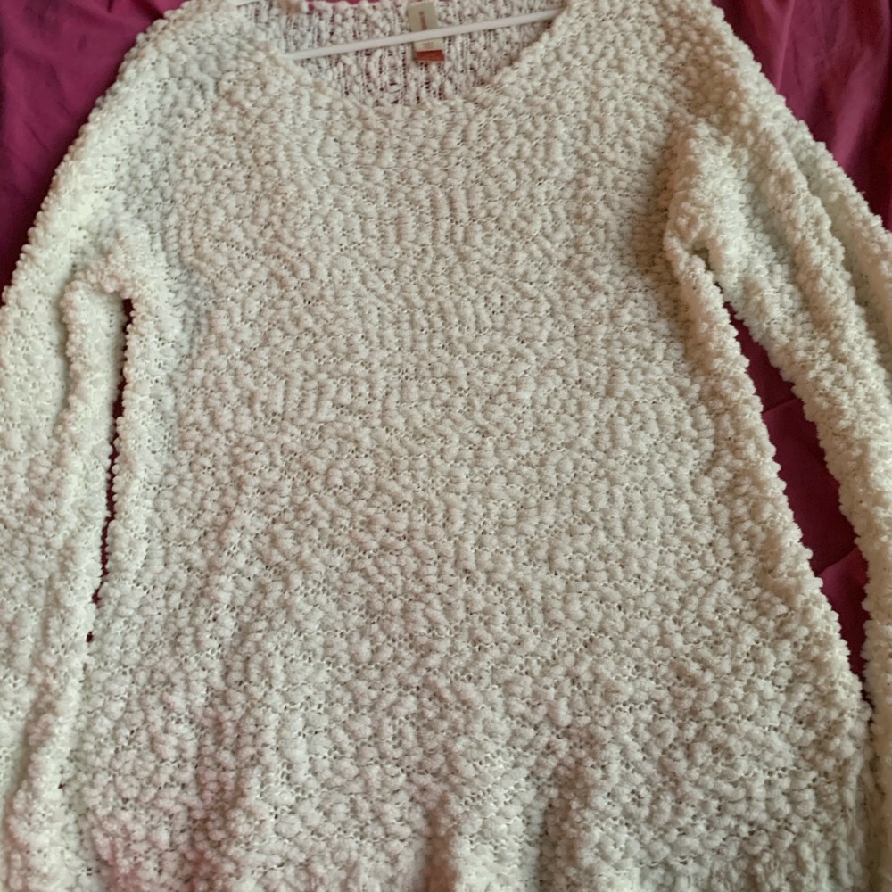 White fluffy sweater.